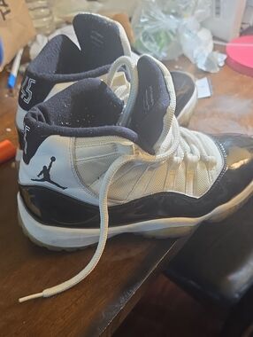 Jordan Retro 11 High-Top Sneakers in White and Black